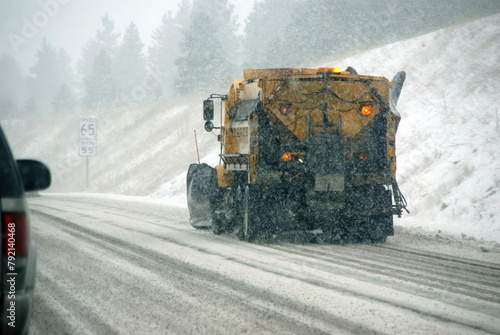 Snowplow truck on icy road