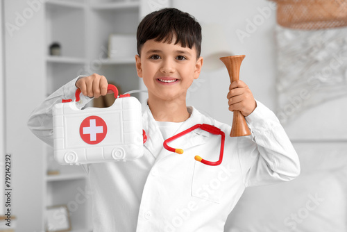 Cute little doctor with ste...
