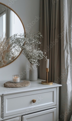 White Dresser With Mirror and Flowers