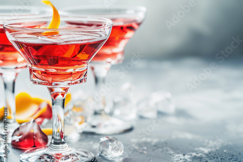 Elegant Cosmopolitan Cocktails Served with Orange Twist and Ice photo