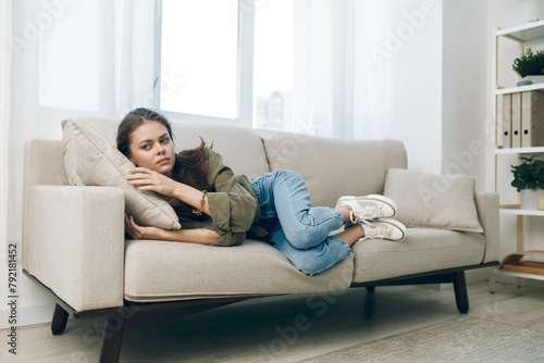 Lonely Woman on the Couch: A Reflection of Mental Health Struggles in a Troubled Home