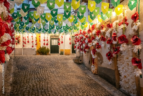 Festa dos Tabuleiros. in Tomar, Portugal. Street in the historic city center, decorated with banners and paper flowers.