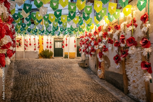 Festa dos Tabuleiros. in Tomar, Portugal. Street in the historic city center, decorated with banners and paper flowers. photo