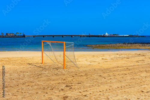 Soccer goal on a sandy beach in Arrecife, Lanzarote Canary Islands. Football field on the sandy beach 