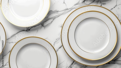 Blank mockup of a set of white dinner plates with a gold rim. .