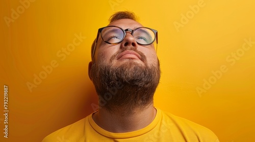 Pensive bearded bald man close up portrait