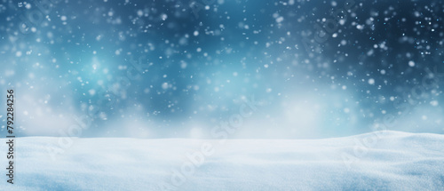 Holidays greeting card with copy-space. Snowy winter landscape with fir trees and snowfall. Winter Xmas background with snow and blurred bokeh.