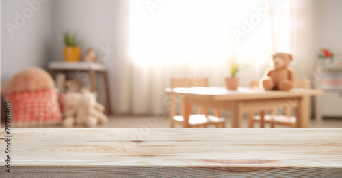 Empty wooden table in baby room interior