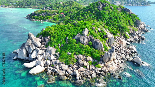 Tableau sur toile From above, witness the dramatic meeting of rocky shores and verdant woodlands, where the deep blue sea paints a picture of serene magnificence