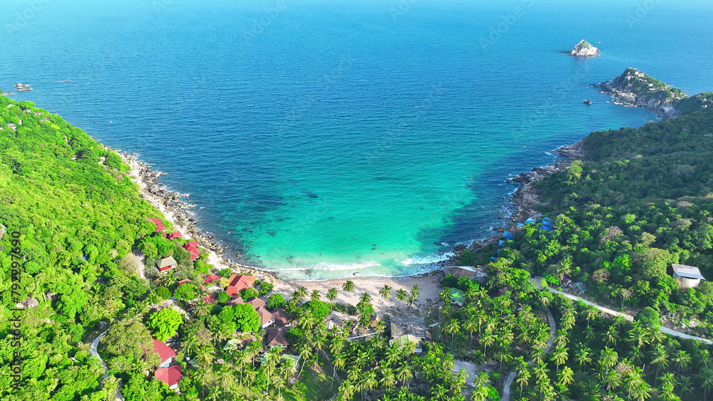 A picturesque resort nestled on verdant sandy shores, where the gentle caress of emerald waves invites you to unwind in blissful harmony with nature's splendor. Koh Tao, Southern Thailand.
