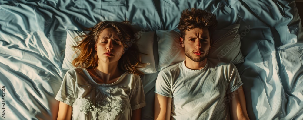 Naklejka premium A couple sleeping in bed top view,