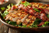 Wood table with grilled chicken and bacon salad close up