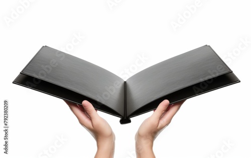 Hand holding a book with blank pages on a white background