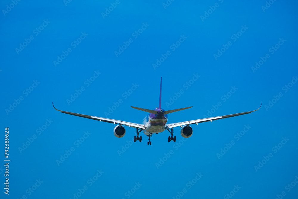 Airplane flying in the sky preparing to land at the airport. Air travel and traveling abroad Airplane flying in the sky preparing to land at the airport. Air travel and traveling abroad