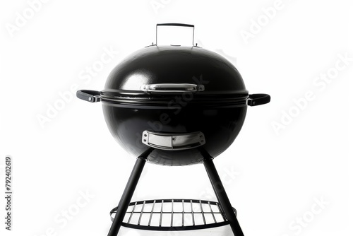 Portable black BBQ grillware stove isolated on white background photo