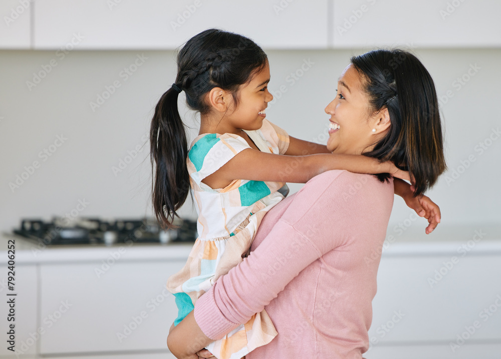 Asian mom, girl and happy with bonding in kitchen for support, love and growth or child development. Parent, kid and smile at home as family, childhood memories and fun together with care and trust Asian mom, girl and happy with bonding in kitchen for support, love and growth or child development. Parent, kid and smile at home as family, childhood memories and fun together with care and trust