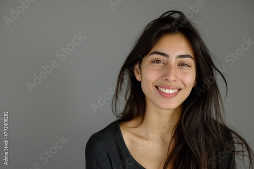 Smiling woman against grey background Closeup