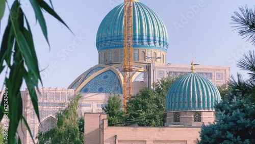 Khast Imam Square with an architectural complex combining ancient religious buildings with modern ones. Lawns, flower beds, shrubs. Cathedral Mosque in Tashkent. 4K photo