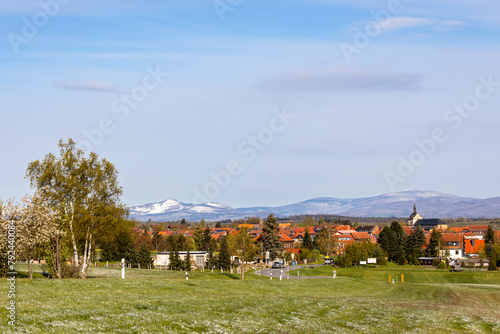 Blick zum verschneiten Brocken im Frühjahr über Hasselfelde photo