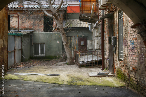 Old abandoned courtyard with old doors and windows