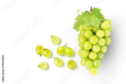 Green grapes and half sliced isolated on white background. Top view. Flat lay. Grape pattern texture background. 