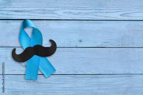 A blue ribbon with black mustache, healthcare concept
