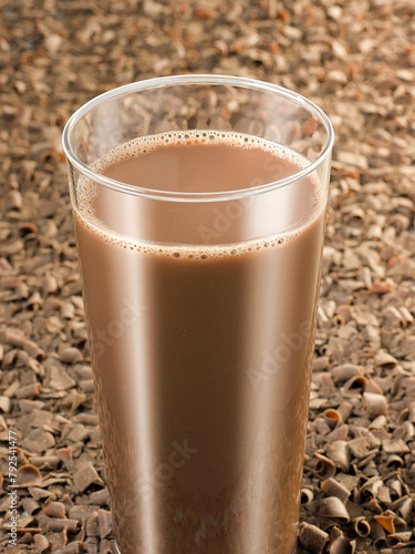 Chocolate milkshake with cocoa cereal background