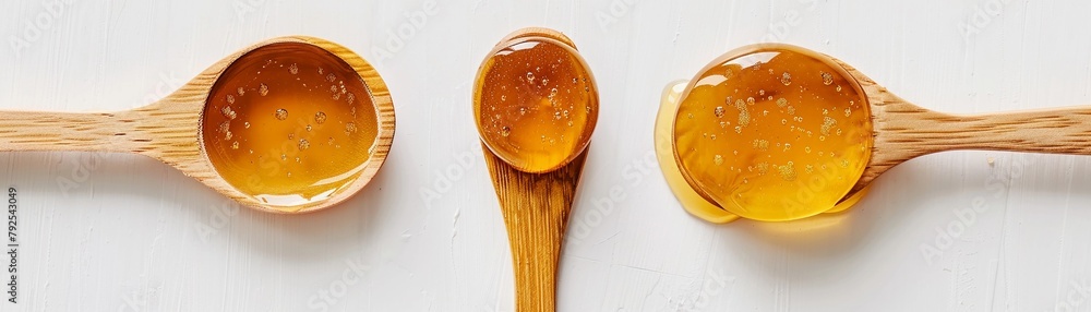 Top view of honey and wooden spoon isolated on white background Top view of honey and wooden spoon isolated on white background