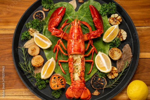 Grilled Lobster with Cheese in wood plate, Grilled Canadian Lobster on wooden background.