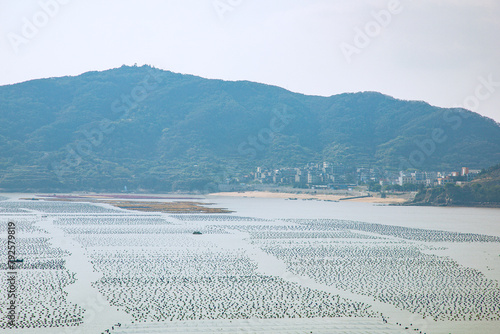 Lianjiang County, Fuzhou City, Fujian Province - Scenery of the bay fishing port against the blue sky photo