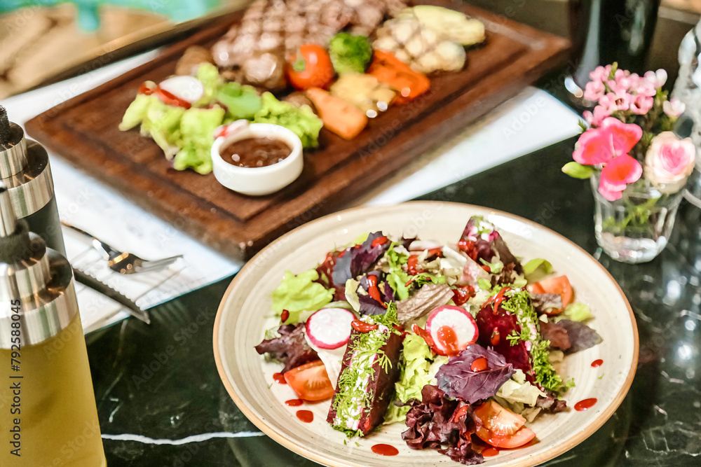 Delicious Plate of Food With Wine Bottle on Table Delicious Plate of Food With Wine Bottle on Table