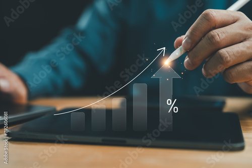 Interest rate and dividend concept, businessman calculating income and return on investment, save, income, return, retirement, compensation fund, investment, dividend tax, stock market, saving, trade. © Looker_Studio