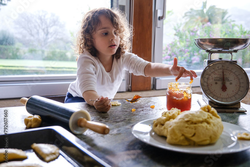The adventure with pastries and jam in the kitchen of a home