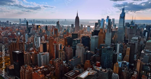 Diverse and varied cityscape of modern New York downtown. Drone footage approaching the skyscrapers in metropolis. photo