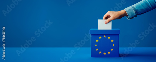 Voting for the European Union election, a hand putting a ballot paper into a ballot box on a blue background with copy space