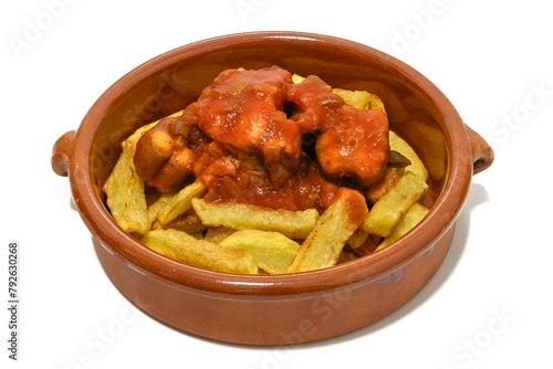 Dogfish in tomato sauce with French fries. Served in a clay bowl. Isolated on a white background. Spanish food concept. The dogfish or vitamin shark (Galeorhinus galeus) .