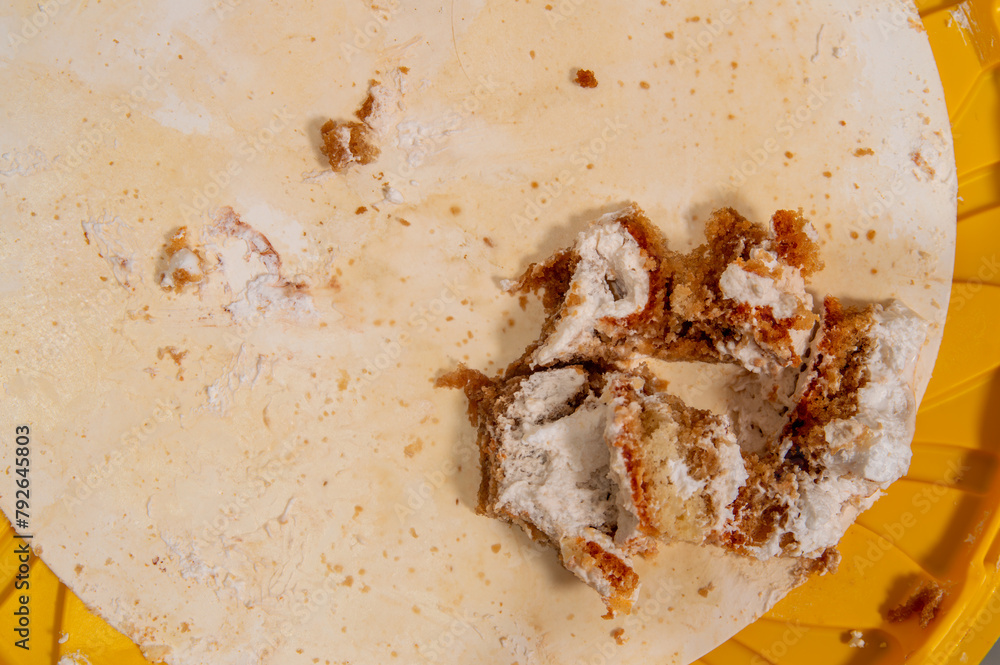 Close up of cake crumbs on table. Crumbs are brown and white Close up of cake crumbs on table. Crumbs are brown and white