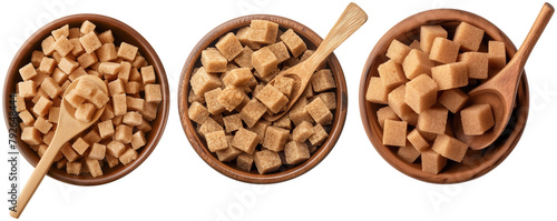 Set of  brown sugar cubes in a bowl with spoon photo