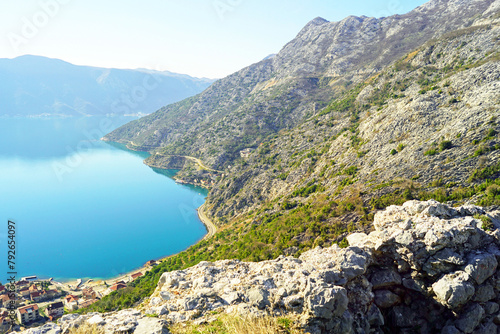 Landscape from the ruins on the Gradine hill, located above the Montenegrin city of Risan - a view of a fragment of the Bay of Kotor and the mountains on a sunny morning.