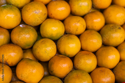 selective focus orange tangerines beautifully arranged in a fruit stand