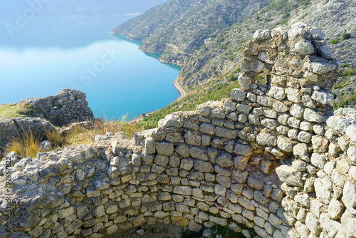 Ruins of a tower in the place of Gradine against the backdrop of the Bay of Kotor (Risan, Montenegro) photo
