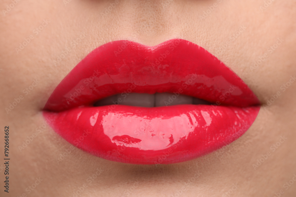 Woman with bright lip gloss, closeup view Woman with bright lip gloss, closeup view
