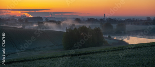 Beautiful, misty sunrise over spring fields