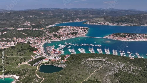 Aerial panoramic video of Rogoznica turquoise bay town and marina, central Dalmatia region of Croatia photo