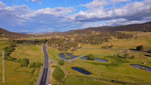 Wide angle view of Crackenback with Alpine road during afternoon in New South Wales, Australia. Drone view. photo
