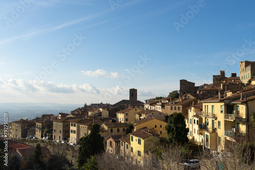 Small houses on a background of hills, blue sky. High quality photo © HV