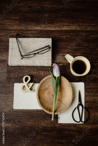 Morning coffee break, artistic flatlay with tulip & accents.