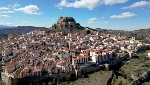 Drone view of Morella City. Situated in top of a hill is an ancient walled city in Castellon Province, Spain. Drone doing backwards revealing all the landscape. Medieval city, travel destination photo
