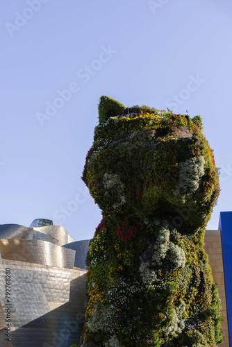 puppy dog statue made with natural flowers photo