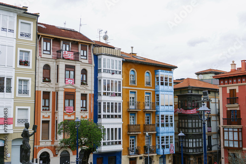 view of the old town colorful houses on cloudy day in portugalete photo